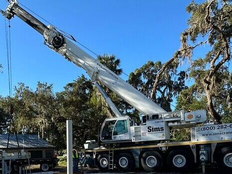Crane loading materials on site for HMI construction project